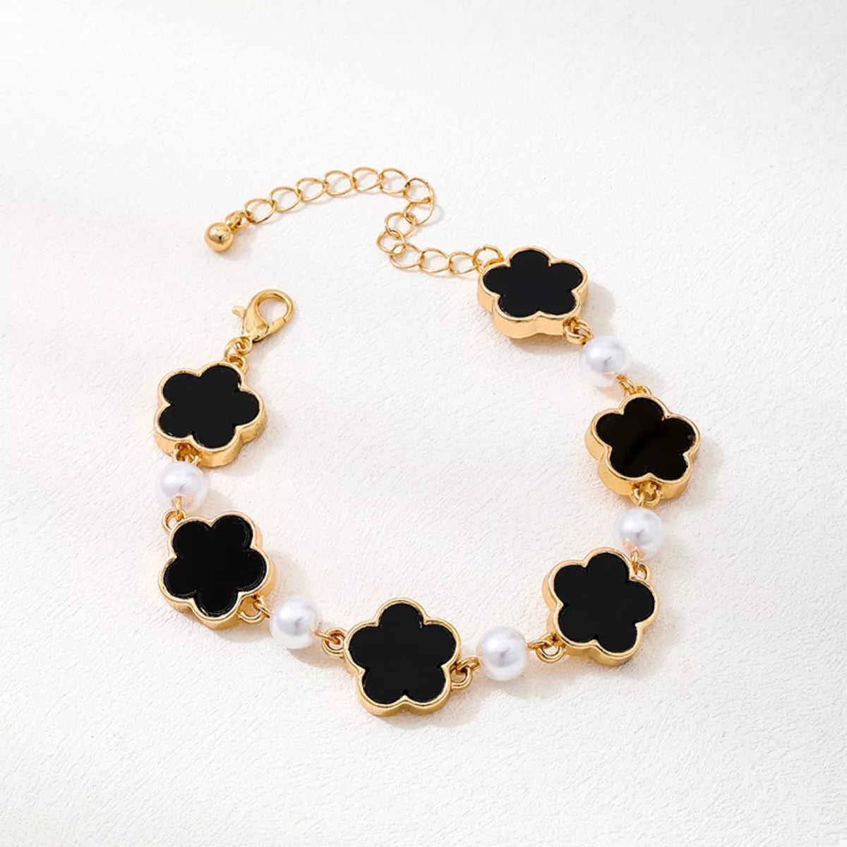 Lucky flower black with gold trim and pearls
