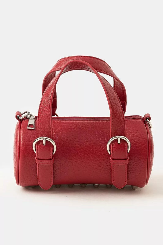 Red cherry leather mini handbag with silver buckle hardware, double handles, and zippered closure for secure carrying.